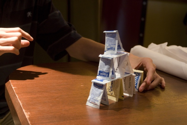 308-6570-Thomas-builds-a-tower-with-sweetener-packets.jpg